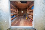 Locking storage shed for guest use to store skis, bikes, toys. Inside you`ll find roasting sticks for use with the large fire pit, as well as patio chairs and lawn games like bocce ball.